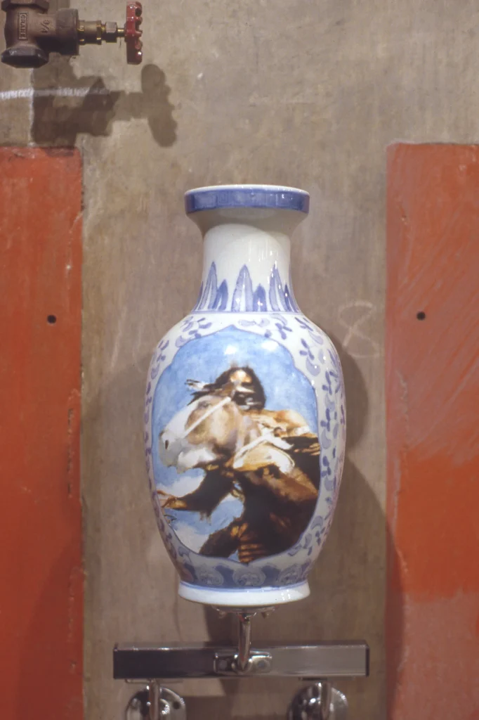 Decorative vase with horse painting.